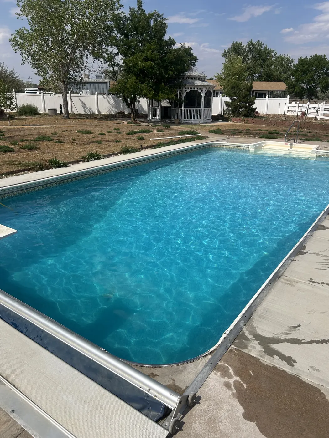 After: the same Todd Creek pool sparkling blue after service by Pyle's in Brighton, CO