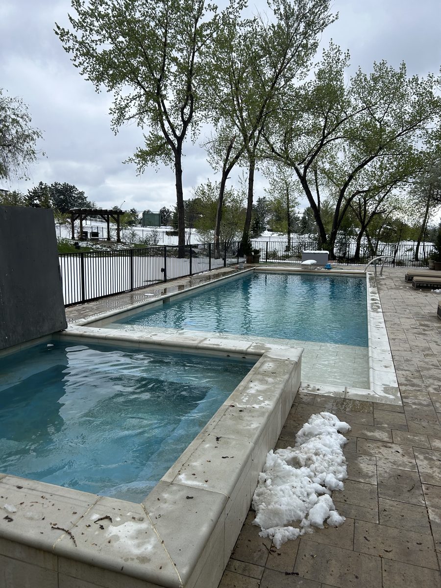 Pool and spa freshly opened for the season — clear water, clean surfaces