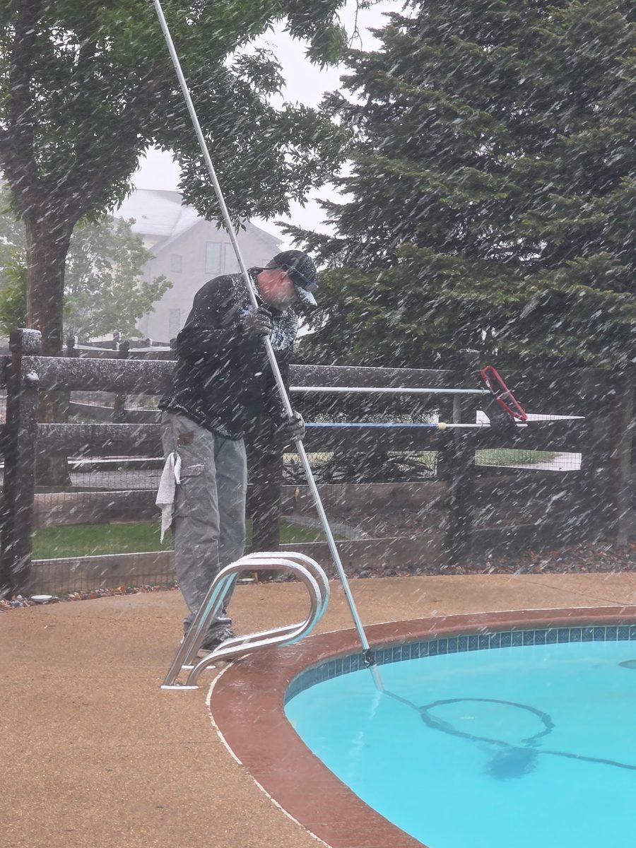 Pool service in progress during heavy snow — Pyle's Pool & Spa never cancels