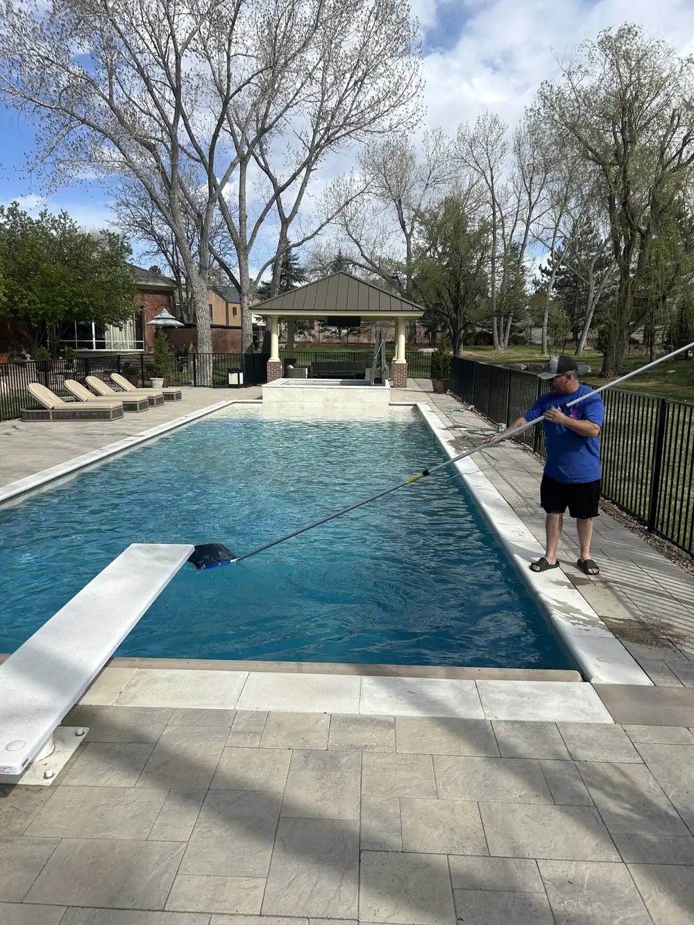 Joel vacuuming an estate pool to completion in Greenwood Village, CO