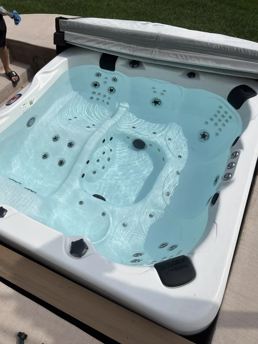 Sparkling clean standalone hot tub with balanced water serviced in Littleton, CO